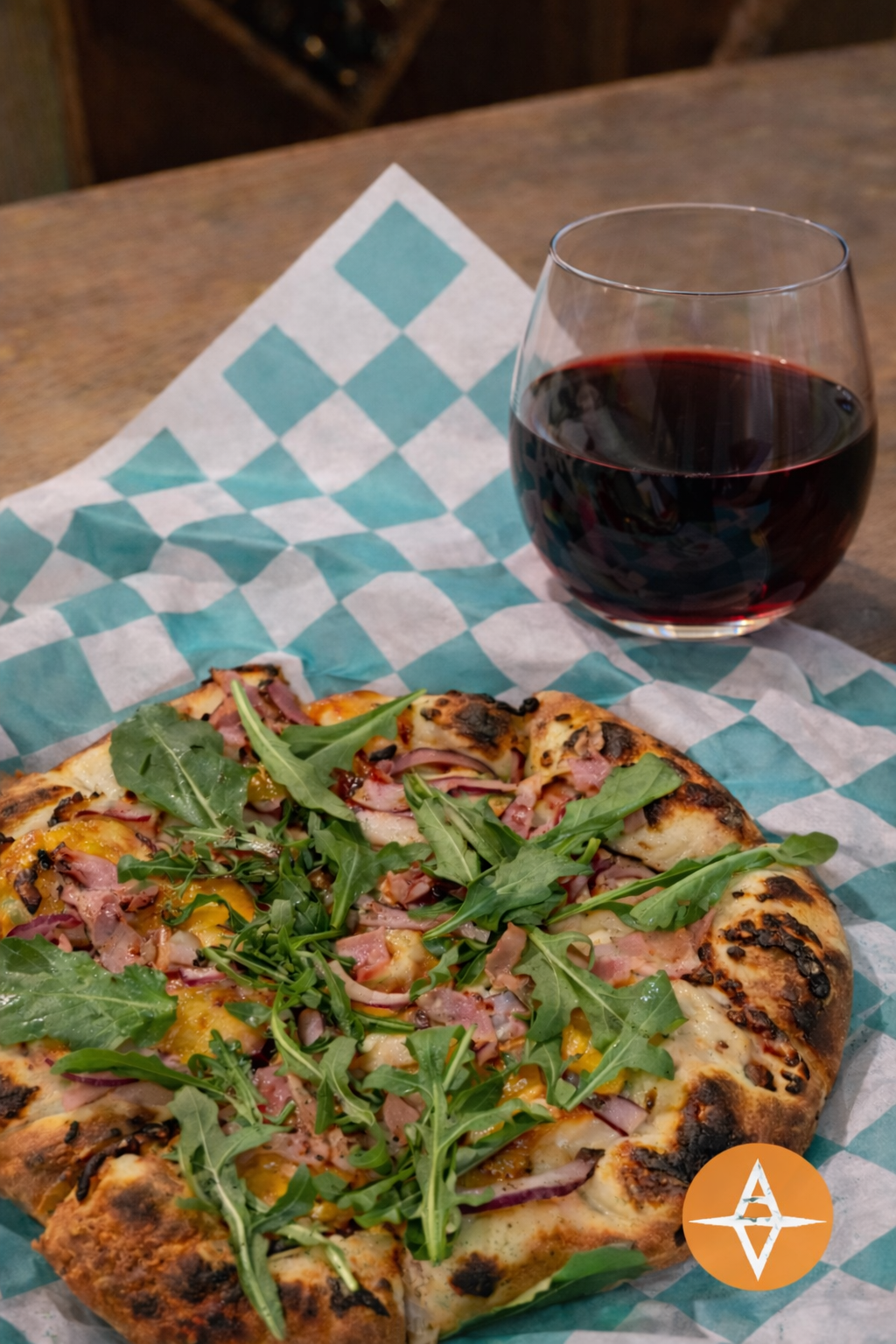 Featuring wine, pizza and Aloria Vineyards AV logo